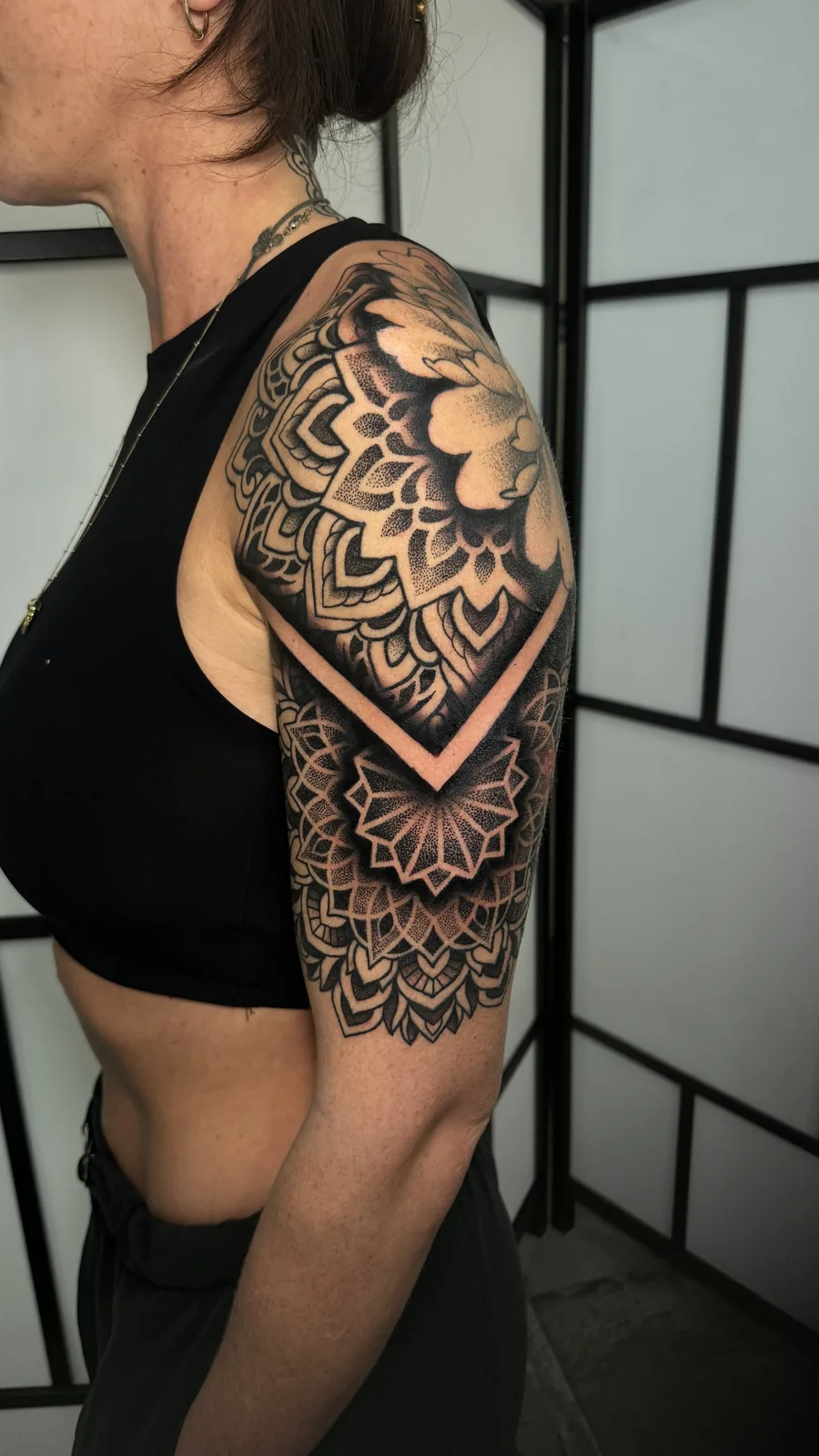 Mehndi-inspired ornamental mandala half sleeve tattoo by Scotty Massa